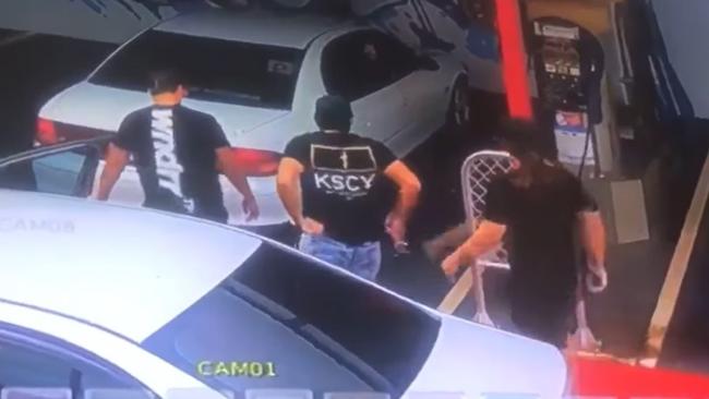 Three men approach a car at the Argos carwash in Tivendale on Sunday before appearing to assault the person inside. Picture: Facebook/Supplied