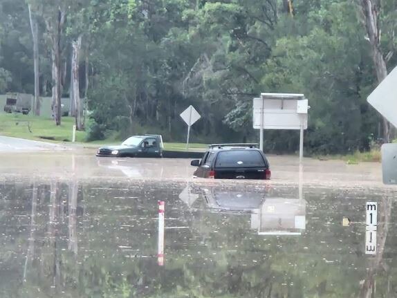 Cars submerged by floodwaters on New Beith Rd at Greenbank on Thursday morning. Picture: Facebook