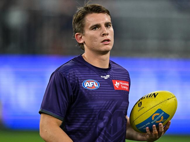 PERTH, AUSTRALIA - MAY 24: Caleb Serong of the Dockers warms up during the 2024 AFL Round 11 match between Walyalup (Fremantle) and the Collingwood Magpies at Optus Stadium on May 24, 2024 in Perth, Australia. (Photo by Daniel Carson/AFL Photos via Getty Images)