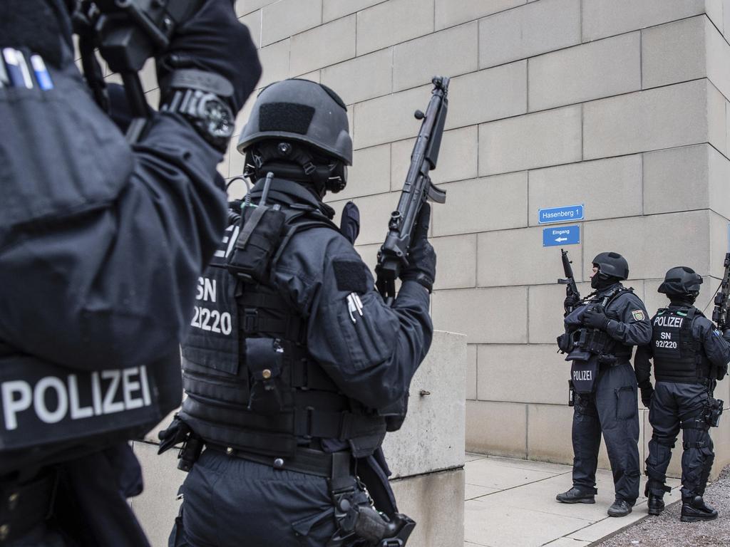 Police officers at a synagogue in Halle, after a shooting that left two people dead. Picture: AP