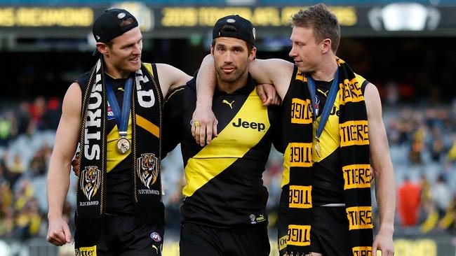 David Astbury, Alex Rance and Dylan Grimes of the Tigers celebrate during the 2019 Grand Final match between the Richmond Tigers and the GWS Giants at the Melbourne Cricket Ground. Picture: Getty Images