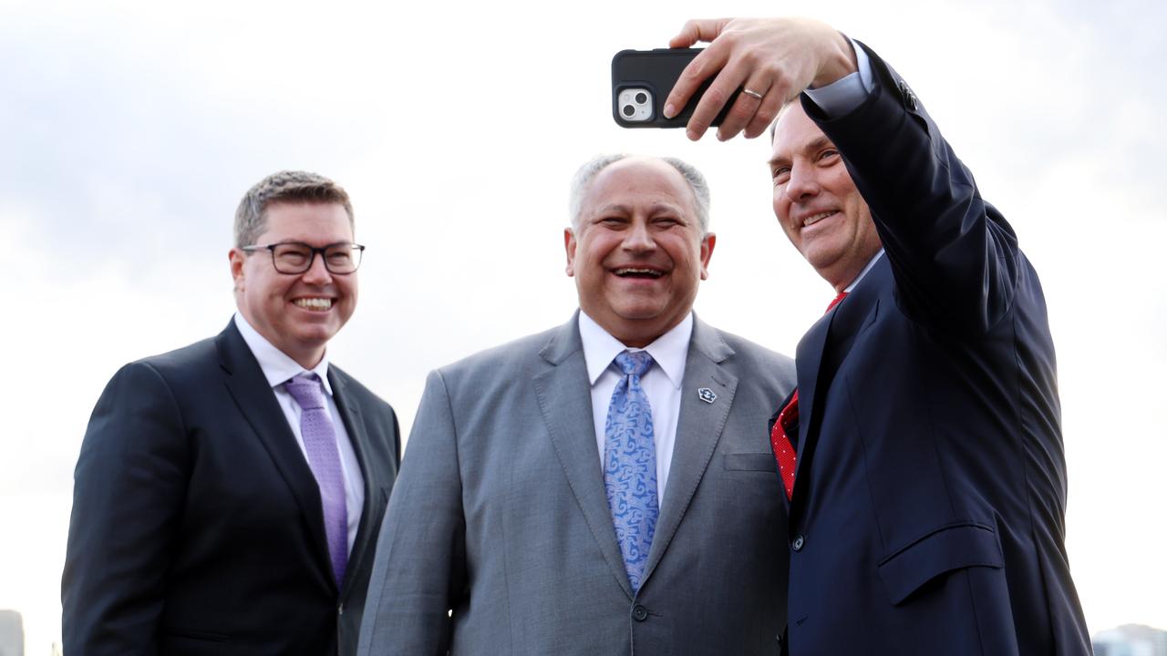 Deputy Prime Minister Richard Marles (right), Defence Industry Minister Pat Conroy (left), and United States Secretary of the Navy Carlos Del Toro take a selfie on board HMAS Canberra. Picture: NCA NewsWire / Damian Shaw