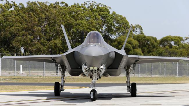 A new F-35A Joint Strike Fighter taxis to it's hanger at Williamtown RAAF base, Monday, December 10, 2018. The Minister for Defence, the Hon Christopher Pyne MP officially welcomed Australia's first two F-35A Joint Strike Fighter aircraft to the RAAF Base Williamtown. (AAP Image/Darren Pateman) NO ARCHIVING