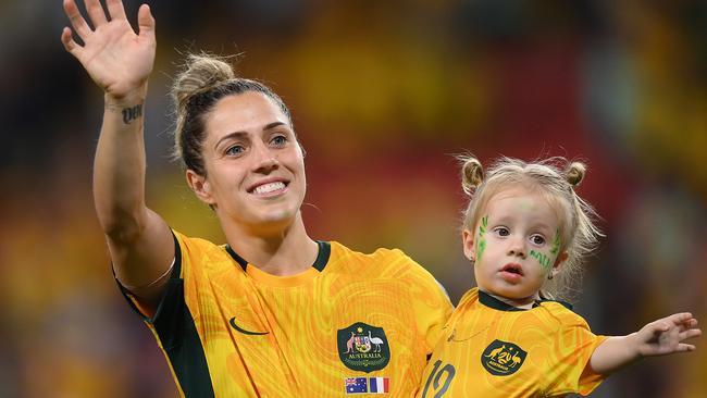 Katrina Gorry of Australia celebrates with her daughter