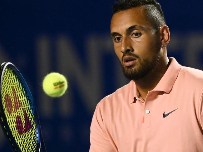 (FILES) In this file photo taken on February 25, 2020 Australia's Nick Kyrgios hits the ball during his Mexico ATP Open 500 men's singles tennis match against France's Ugo Humbert in Acapulco, Guerrero State, Mexico. - Outspoken Nick Kyrgios pulled out of the US Open August 1, saying he was giving it a miss for "the hundreds of thousands of Americans who have lost their lives". (Photo by PEDRO PARDO / AFP)