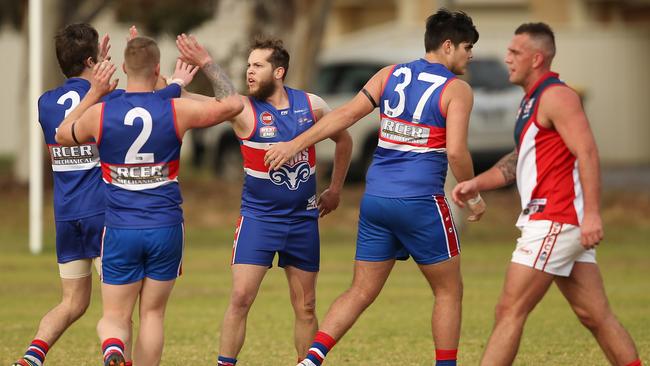 Gepps Cross celebrate a goal during the Amateur Football game between Gepps Cross and Eastern Park in Northgate, South Australia, Saturday, July 8 2017. (AAP Image/James Elsby)