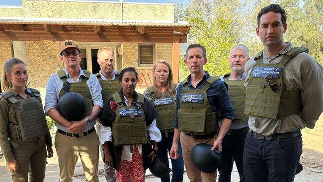 An IDF soldier, Andrew Wallace (LNP), Joel Burnie (Australia/Israel &amp; Jewish Affairs Council), Michelle Ananda-Rajah (ALP), Zoe McKenzie (Lib), Simon Birmingham (Lib), David Fawcett (Lib), Josh Burns (ALP) while on a tour of the Kfar Aza kibbutz.