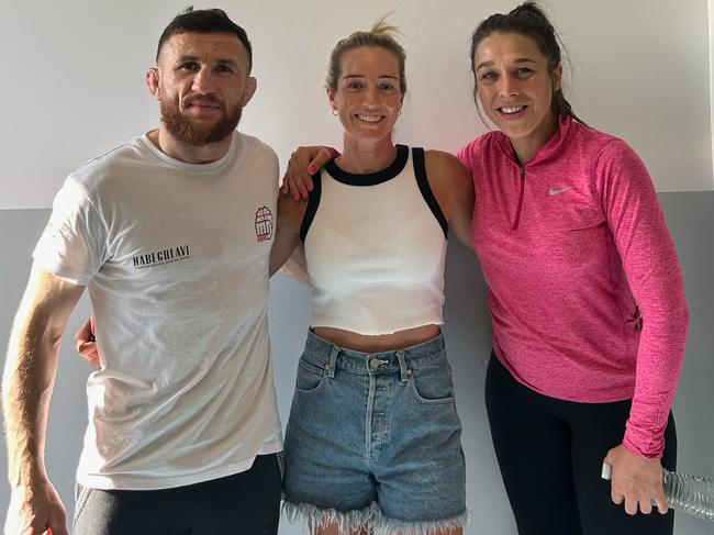 UFC fighters Merab Dvalishvili and Joanna Jedrzejczyk and Tara Coleman (middle) at PCYC Eastern Suburbs.