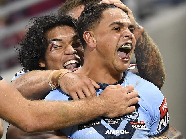 TOWNSVILLE, AUSTRALIA - JUNE 09:  Latrell Mitchell of the Blues celebrates with team mates after scoring a try during game one of the 2021 State of Origin series between the New South Wales Blues and the Queensland Maroons at Queensland Country Bank Stadium on June 09, 2021 in Townsville, Australia. (Photo by Ian Hitchcock/Getty Images)