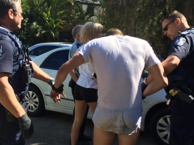 Police help an overdose victim found wildly hallucinating at Mermaid Waters.