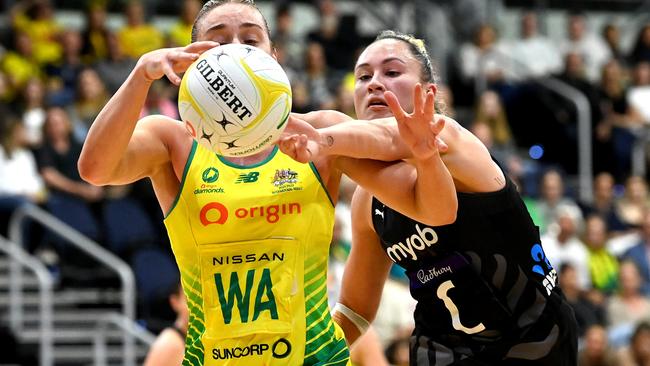 Skipper Liz Watson and Whitney Souness challenge for the ball. Picture: Bradley Kanaris/Getty Images