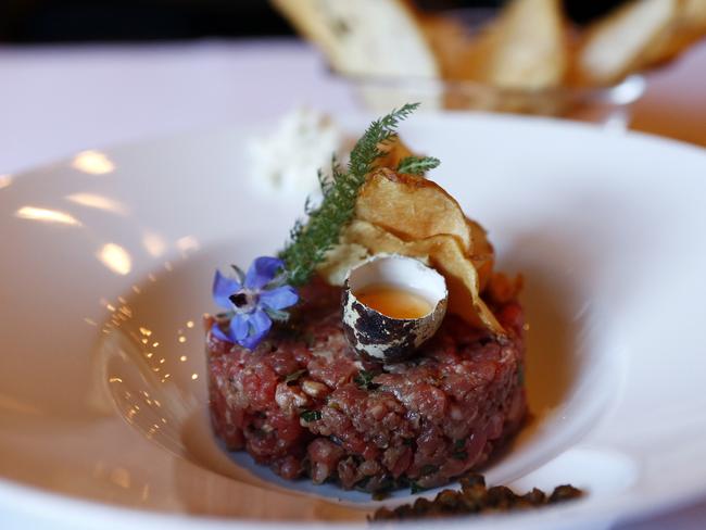 The steak tartare is made of high-quality creamy sirloin and topped with a quail egg and thin sliced crisps. Picture: Tim Hunter