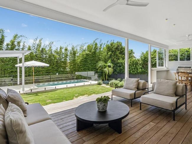 The five-bedroom home features a garden and an entertainer’s deck which opens to a pool. Picture: realestate.com.au