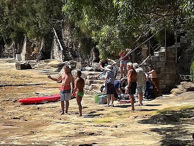 Brave locals brought the woman to safety after she was bitten above the right knee about 1.30pm. Picture Kevin McKay/Instagram