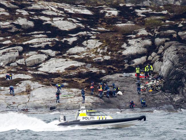 Police and rescue workers investigate the scene following Friday’s crash. Picture: Torstein Boe / NTB Scanpix via AP