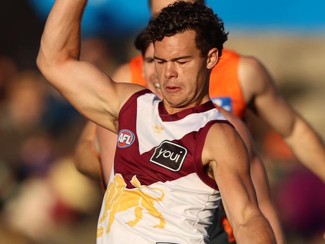 CANBERRA, AUSTRALIA - JULY 16: Cam Rayner of the Lions kicks on goal during the round 18 AFL match between the Greater Western Sydney Giants and the Brisbane Lions at Manuka Oval on July 16, 2022 in Canberra, Australia. (Photo by Robert Cianflone/Getty Images)