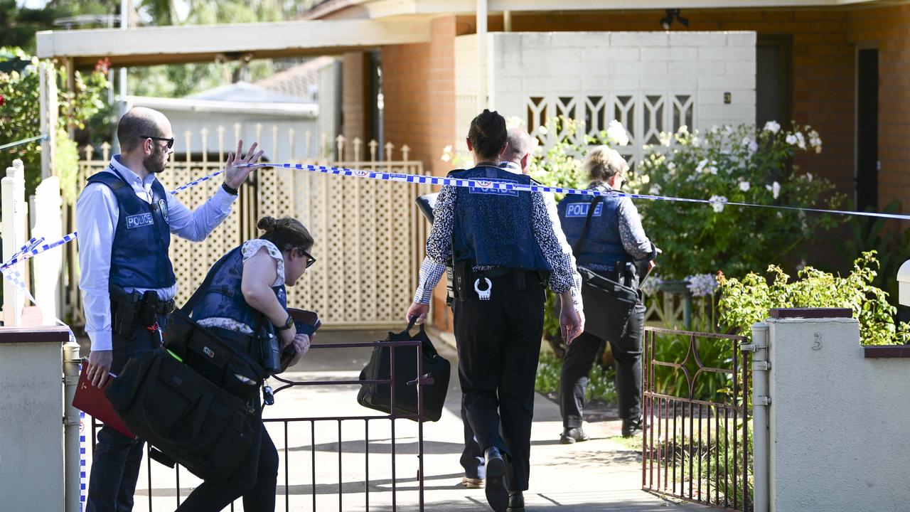 Police and detectives investigate the alleged double murders on Sunday. Picture: Mark Brake