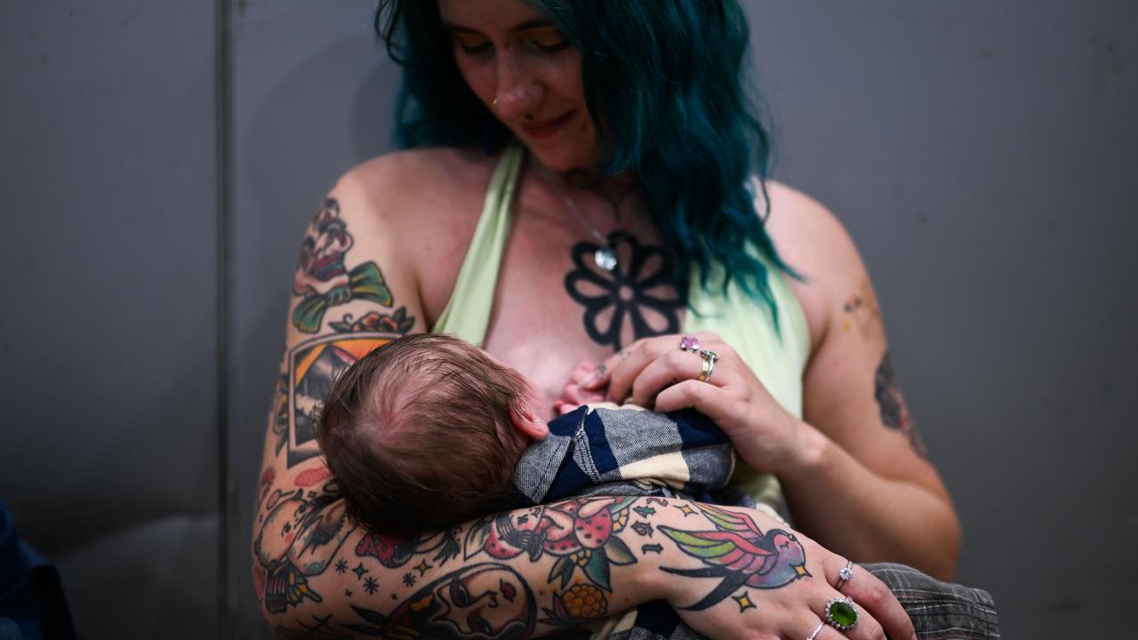 Tattoo enthusiast Loki breastfeeds her son Avalon at the Australian Tattoo Expo in Brisbane. Picture: Dan Peled / NewsWire