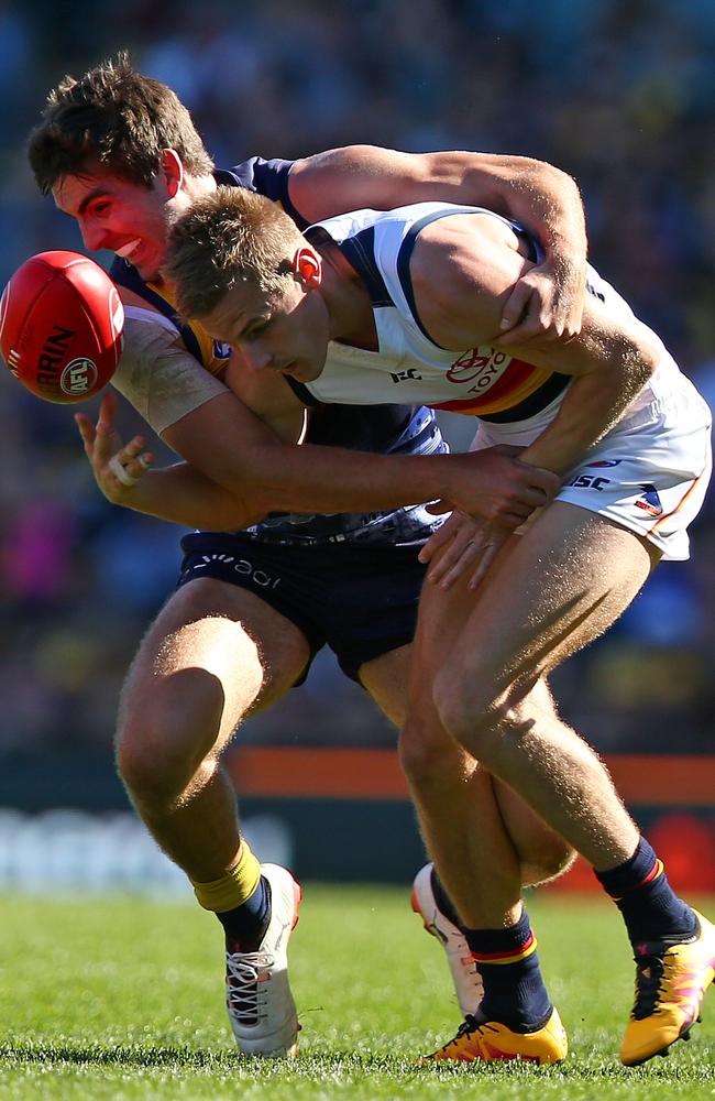 Andrew Gaff of the Eagles tackles David Mackay of the Crows.