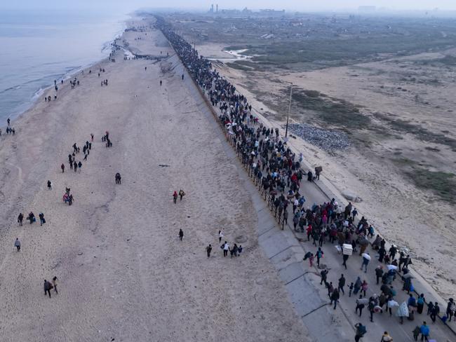 An aerial photograph taken by a drone shows displaced Palestinians return to their homes in the northern Gaza Strip. Picture: AP