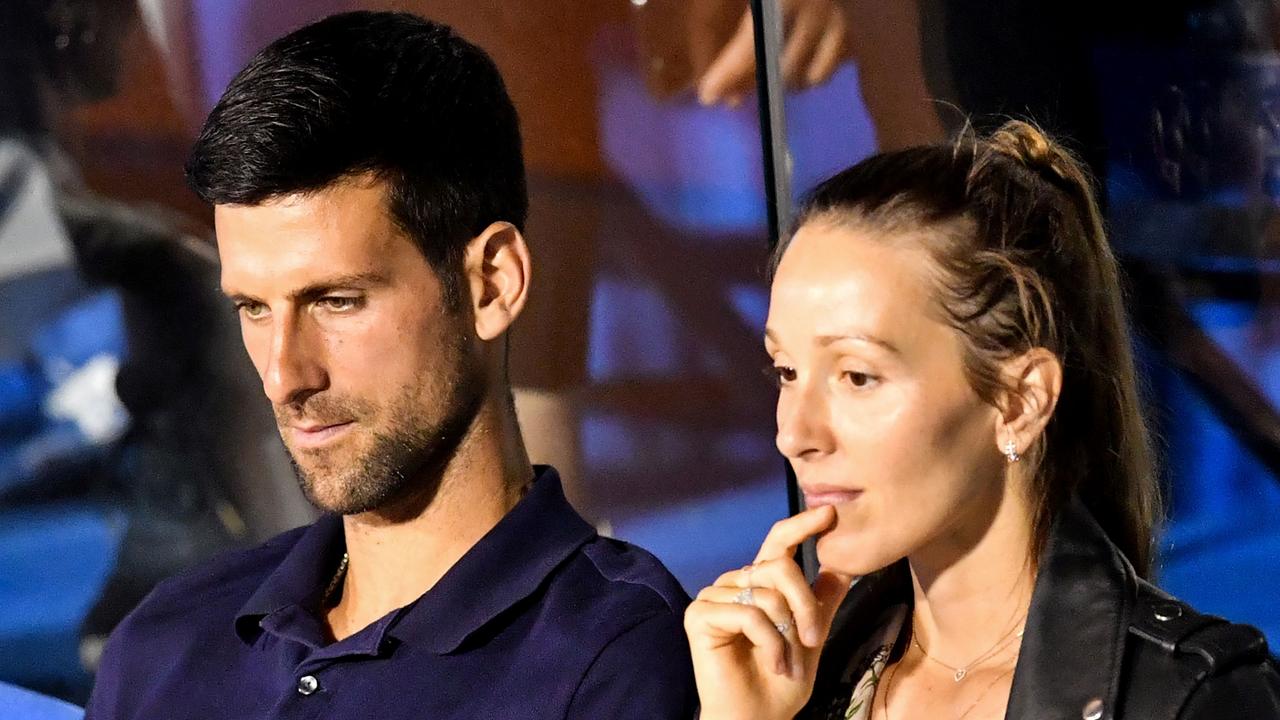 Serbian tennis player Novak Djokovic and his wife Jelena. (Photo by Andrej ISAKOVIC / AFP)