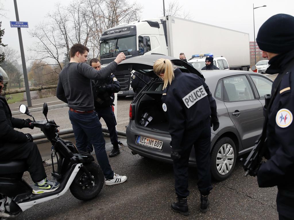 French police officers control cars at the French-German border following a shooting in Strasbourg, eastern France.  Picture:  AP