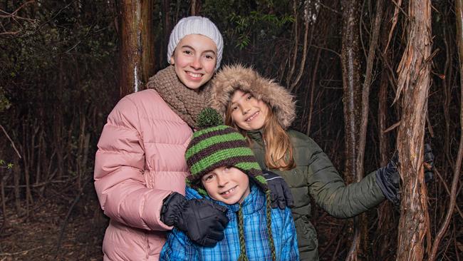 Eva Redrup aged 12, Taj Rudrup aged 8 from Woodbridge and Emi Alexander aged 9 from Central Coast NSW were rugged up ready for a walk on Mount Wellington / kunanyi on Sunday 14th July 2024.Picture: Linda Higginson