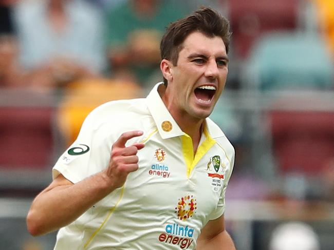 BRISBANE, AUSTRALIA - DECEMBER 08: Pat Cummins of Australia celebrates dismissing Haseeb Hameed of England during day one of the First Test Match in the Ashes series between Australia and England at The Gabba on December 08, 2021 in Brisbane, Australia. (Photo by Chris Hyde/Getty Images)