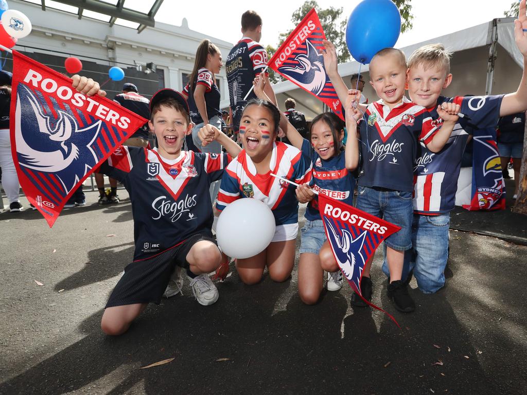 Roosters fans Riley O'Halloran , Stella Joson , Kimi Rivera , Lucas Crawford and Keelan Crawford pictured at the Sydney Roosters fan morning at Moore Park after the Roosters win in the 2019 NRL Grand Final. Picture: Richard Dobson