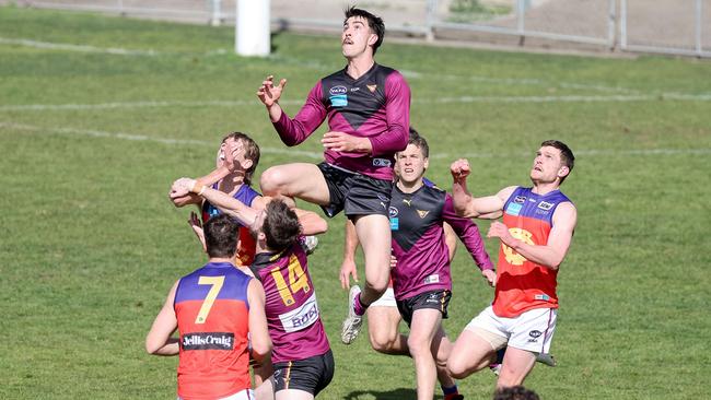 Noah Gown of Old Haileybury takes a mark. Picture : George Salpigtidis