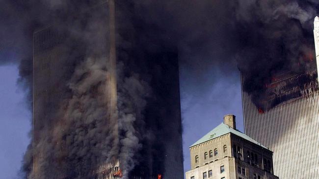 The twin towers of World Trade Center burn after two planes crashed into each building. Picture: Stan Honda