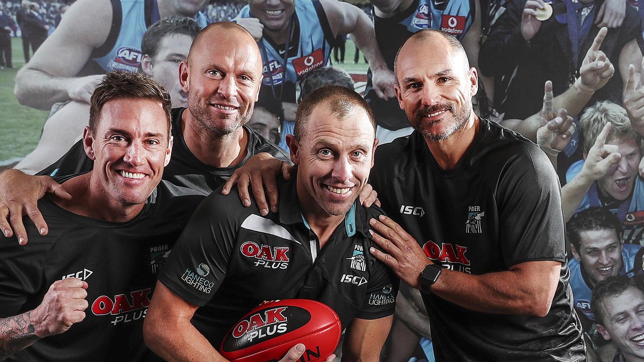Michael Wilson, holding the ball, has been let go by Port Adelaide from his physio role at the club because of the COVID-19 pandemic and its impacts on club finances. Picture SARAH REED
