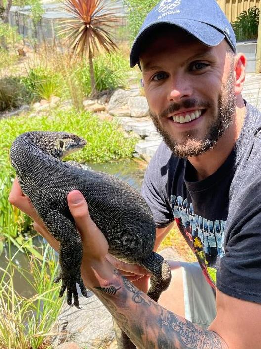 Chalmers hanging with Gary the mertens’ water monitor … he has transformed a double garage into a reptile room. Picture: Instagram