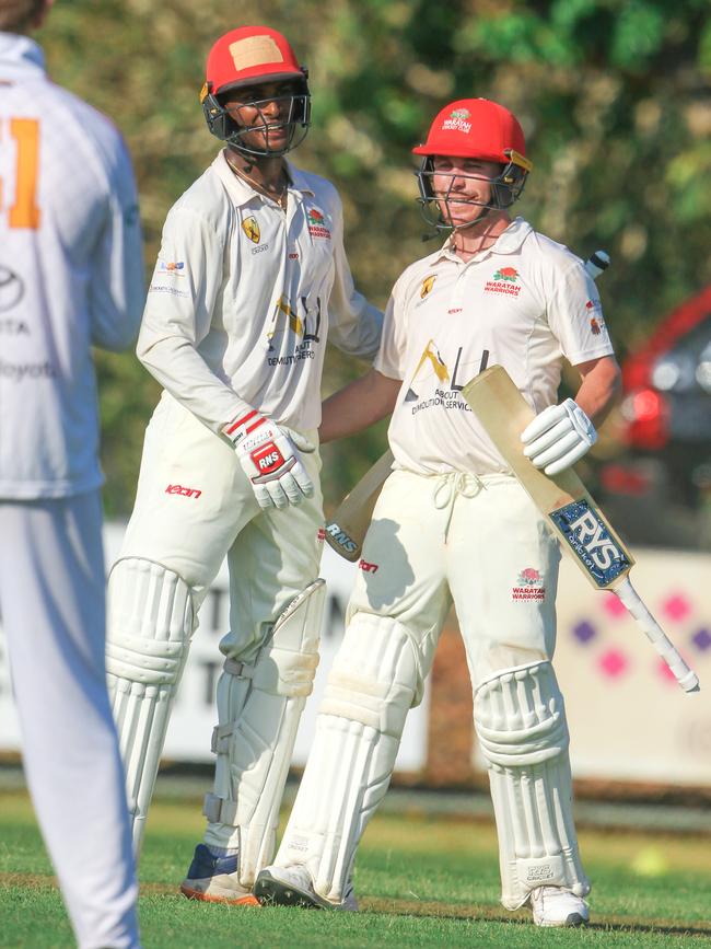 Ash Chandrasinghe celebrates his record breaking hundred with Isaac Conway. Picture: Glenn Campbell