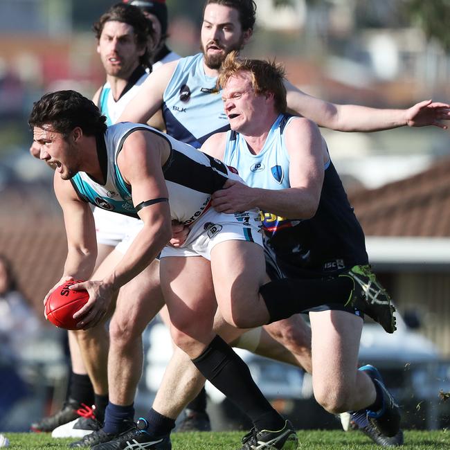 Thor Boscott is tackled by Lindisfarne’s Joseph Miller in round two. Picture: NIKKI DAVIS-JONES