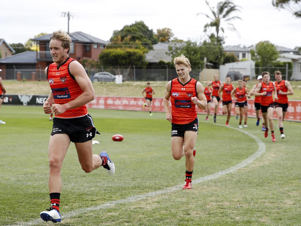 Darcy Parish (left) and Ned Cahill lead the way during a training session at The Hangar. Picture: Dylan Burns/AFL Photos via Getty Images