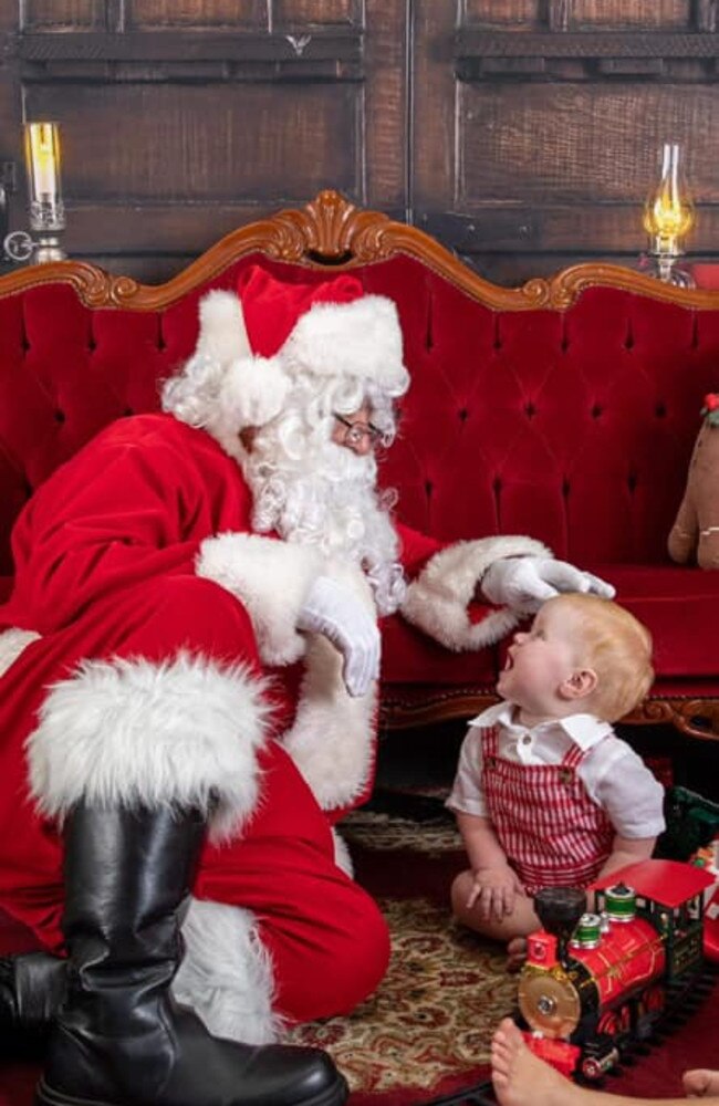 Dusty Boyle (aged 1 years old) with Santa (Mr Poppa’s Balloons): Indigo Blue Photography studio 2023 - Mackay. Sent in by Kiera Boyle.