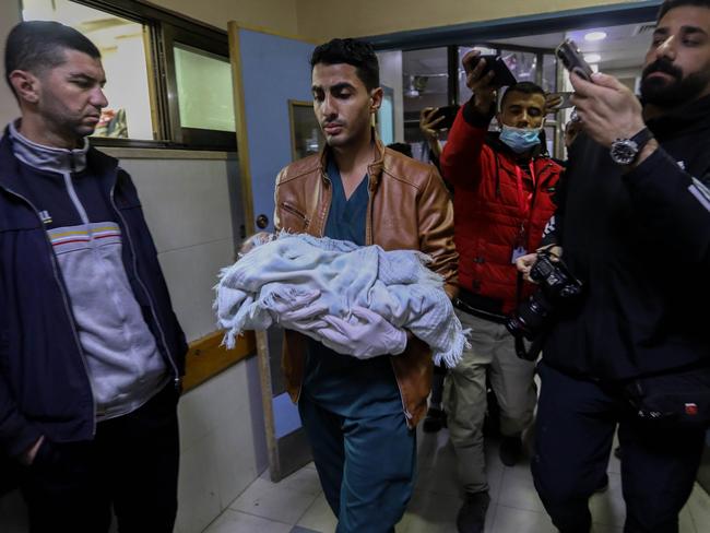 A Palestinian infant injured in Israeli air strikes arrives for treatment at Nasser Medical Hospital in Khan Yunis, Gaza. Picture: Getty Images