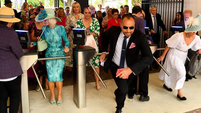 Racegoers make a run for the best spots. Picture: Flemington