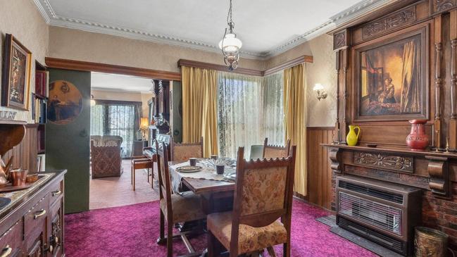 A second timber mantel is in the formal dining room.