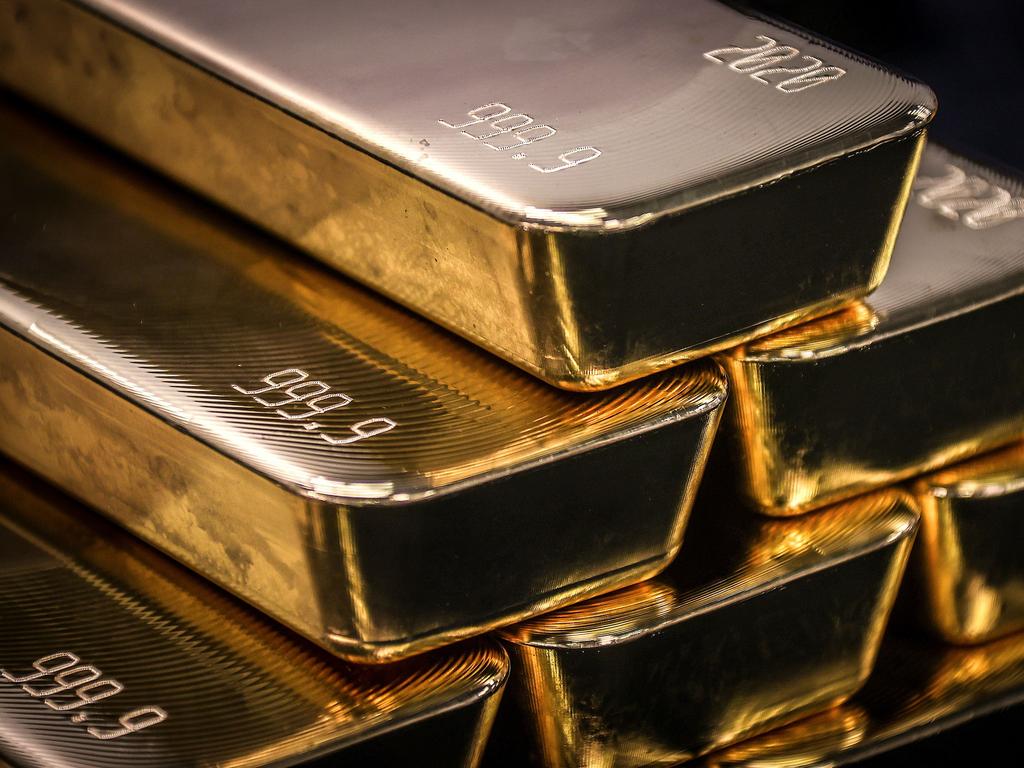 TOPSHOT - Gold bullion bars are pictured after being inspected and polished at the ABC Refinery in Sydney on August 5, 2020. - Gold prices hit 2,000 USD an ounce on markets for the first time on August 4, the latest surge in a commodity seen as a refuge amid economic uncertainty. (Photo by DAVID GRAY / AFP)