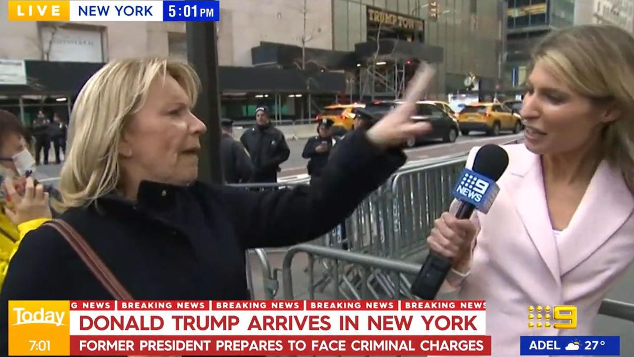 The fan waves a hand in the reporter’s ‘fake’ face. Picture: Channel 9.