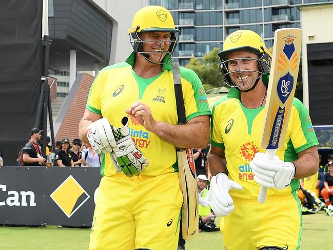 MELBOURNE, AUSTRALIA - FEBRUARY 09: Matthew Hayden and Justin Langer walk out to bat during the Bushfire Cricket Bash T20 match between the Ponting XI and the Gilchrist XI at Junction Oval on February 09, 2020 in Melbourne, Australia. The match is being staged as part of 'The Big Appeal', raising funds for the Australian Bushfire Appeal. (Photo by Quinn Rooney/Getty Images)