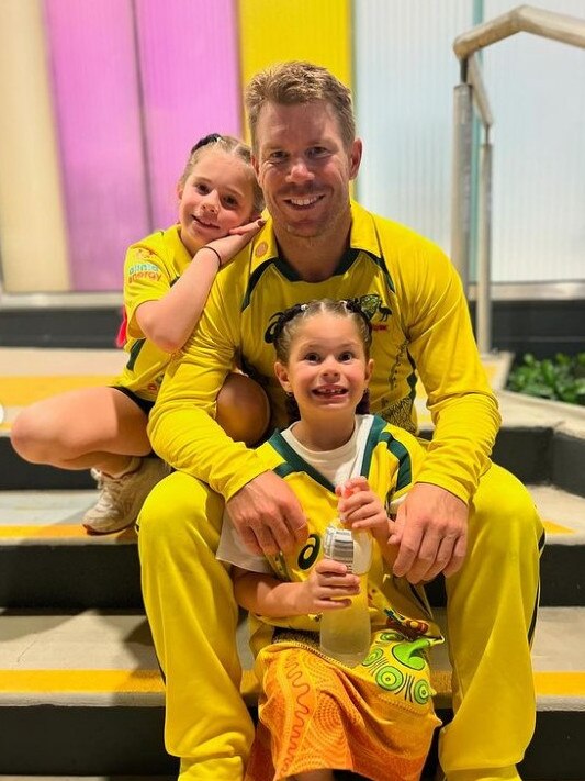 David Warner with his daughters.