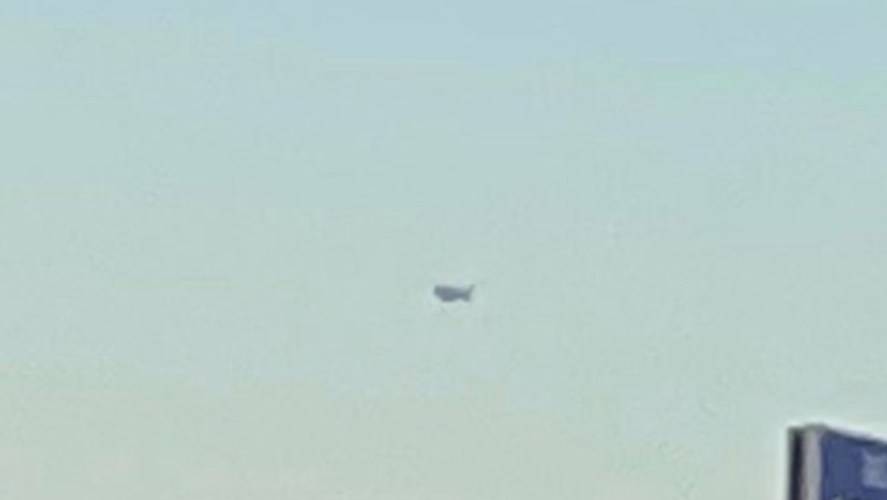 A dark object as large as a ‘truck’ was filmed hovering in the sky over the Arizona desert on Monday by a couple who claimed it remained there as they travelled for 186km.