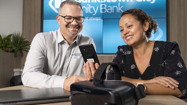 GM Steve Vassallo shows an app to customer service officer Alison O'Grady. Picture: Matthew Vasilescu