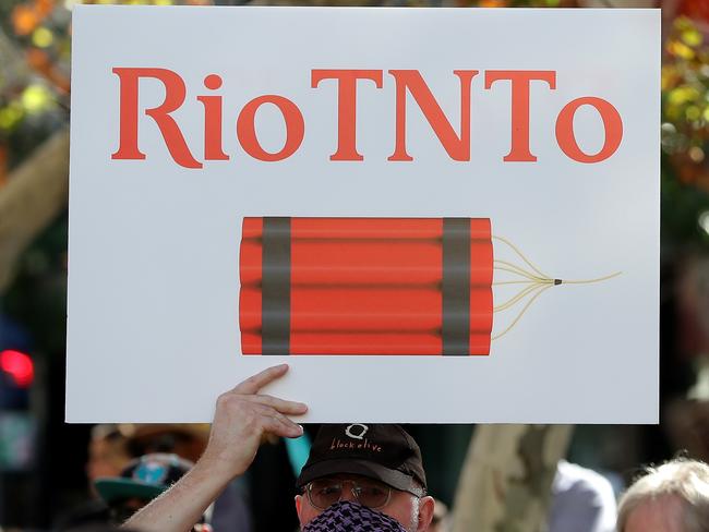 Protesters are seen during a rally outside the Rio Tinto office in Perth, Tuesday, June 9, 2020.. Rio Tinto recently detonated explosives in an area of the Juukan Gorge in the Pilbara, destroying two ancient deep-time rock shelters, much to the distress of the Puutu Kunti Kurrama and Pinikura people. (AAP Image/Richard Wainwright) NO ARCHIVING