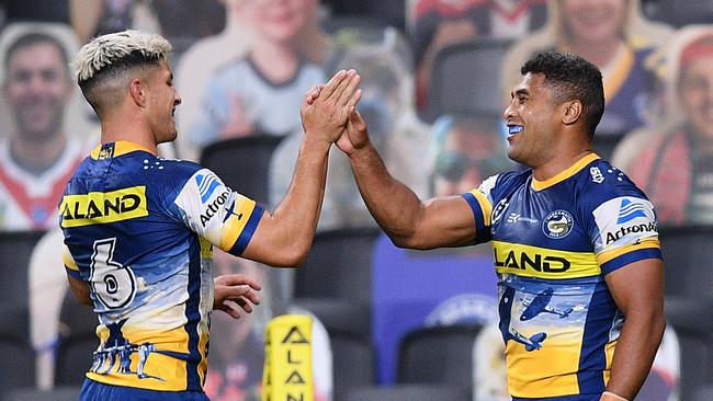 Michael Jennings, right, celebrates with Dylan Brown after scoring a try for Parramatta against Manly last weekend Picture: AAP