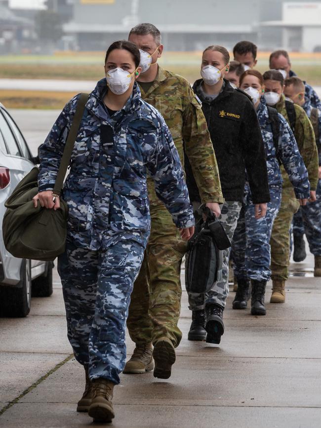 Australian Defence Force personnel from Adelaide disembarking on a Royal Australian Air Force C-130J Hercules aircraft at Melbourne Jet Base airport on Operation COVID-19 Assist.
