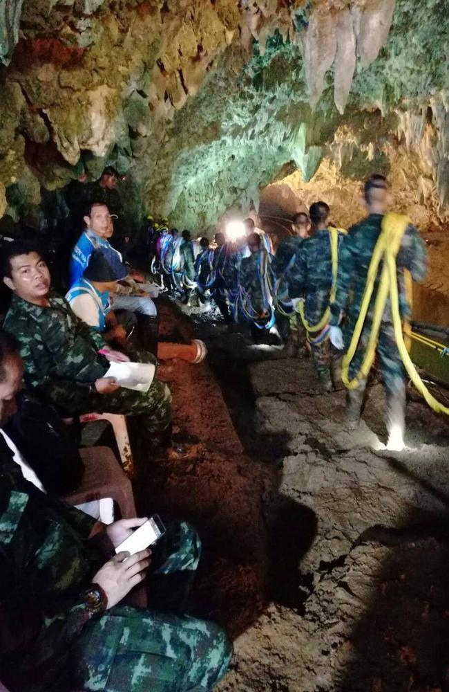 Thai soldiers enter the caves where a youth soccer team and their coach went missing more than a week ago. Picture: AFP